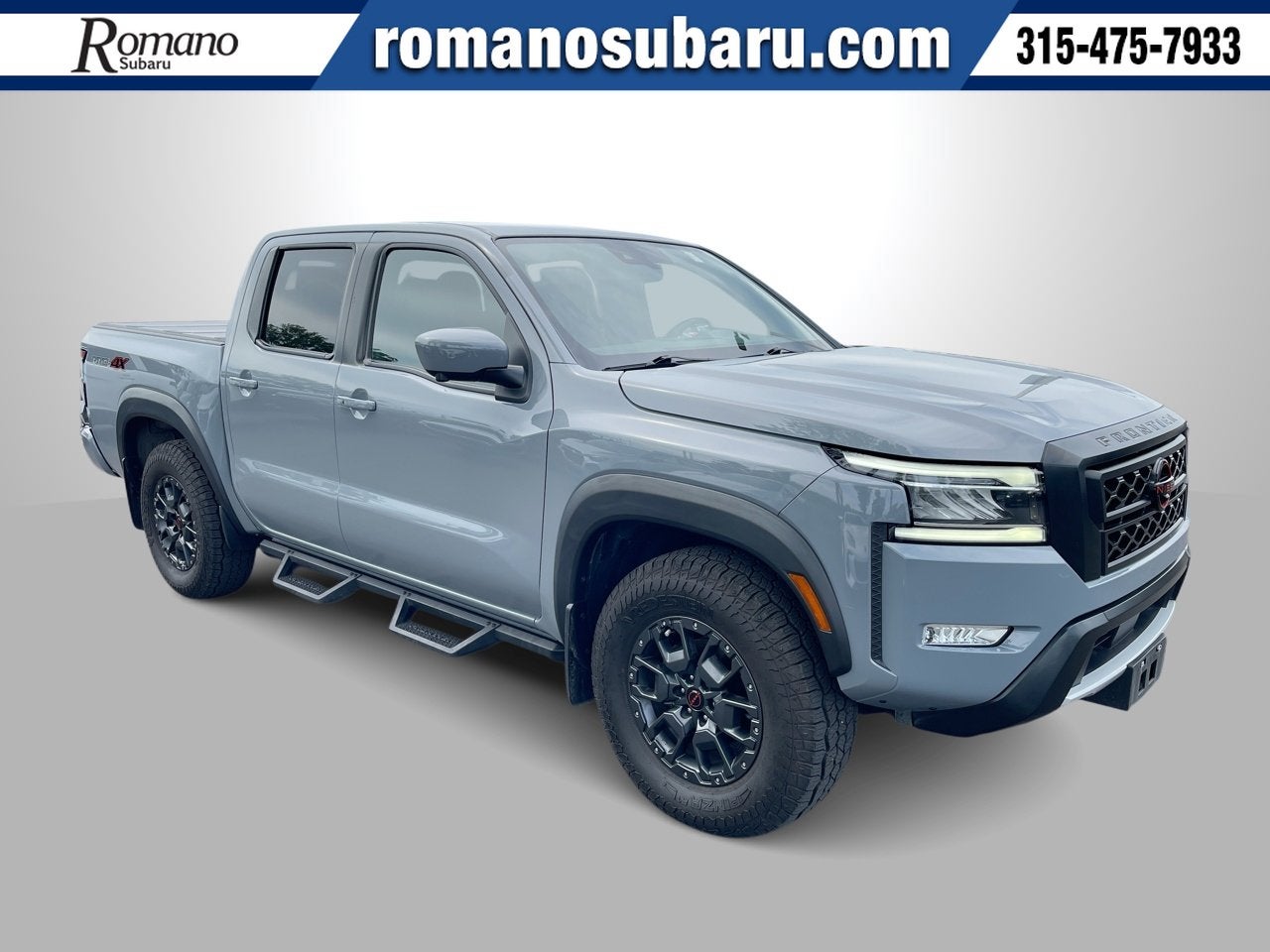 2024 Nissan Frontier PRO-4X in Boulder Gray Pearl — front three-quarter view