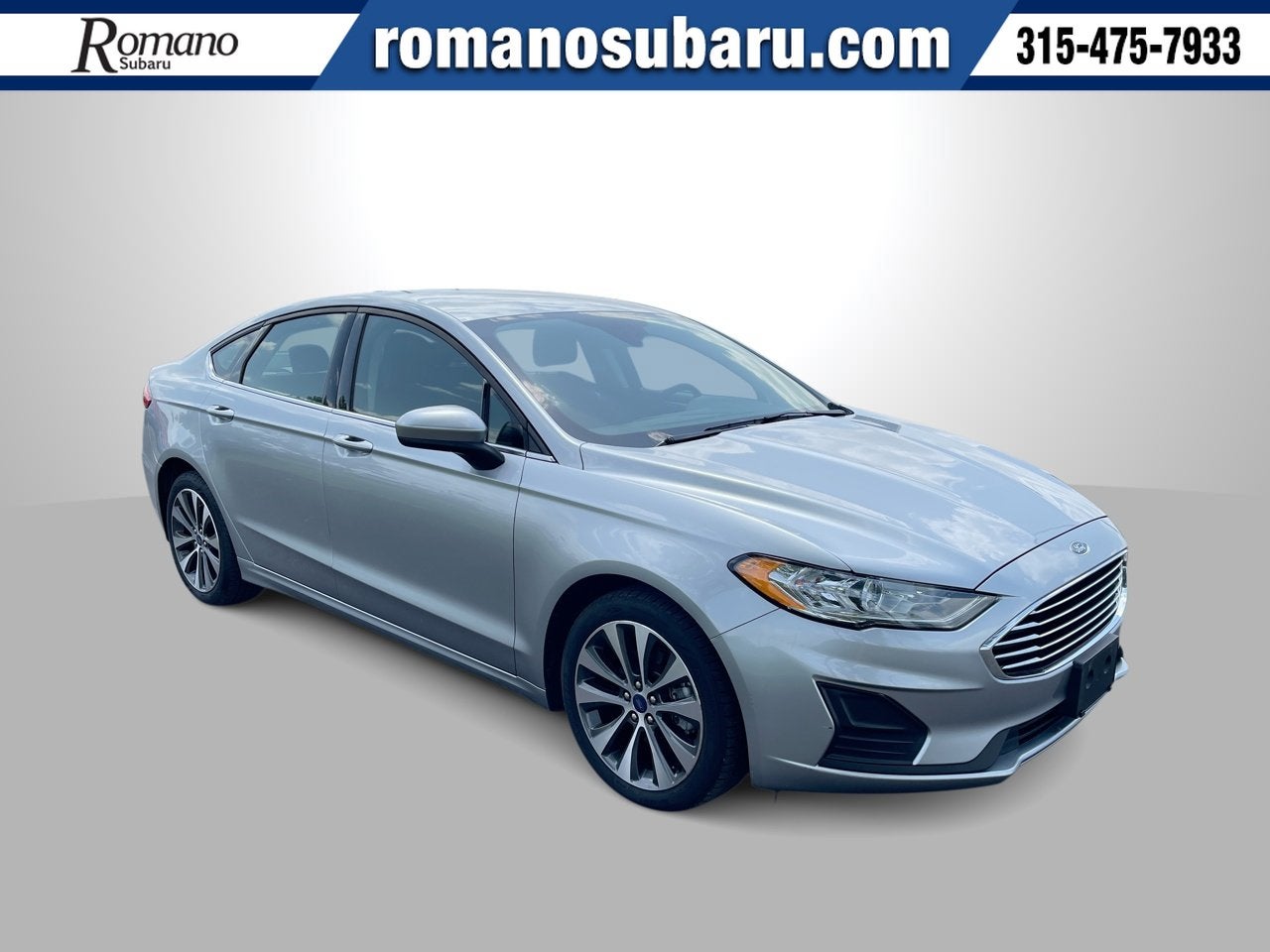 2020 Ford Fusion SE in Iconic Silver Metallic — front three-quarter view