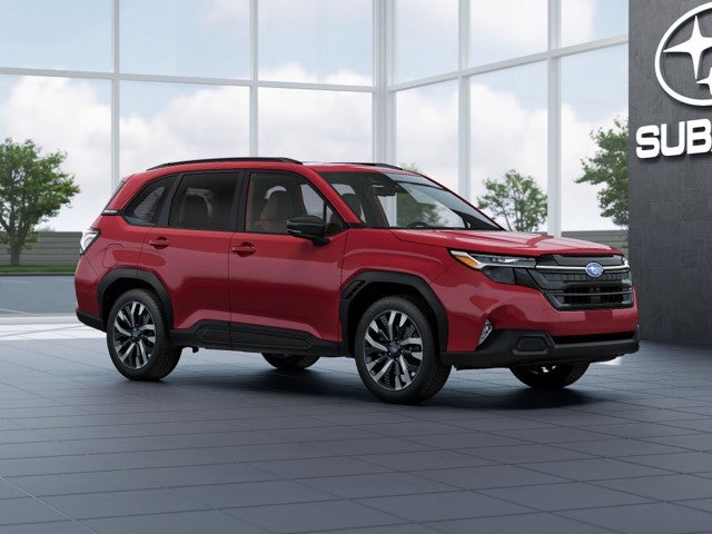 2026 Subaru FORESTER Touring in Crimson Red Pearl — front three-quarter view