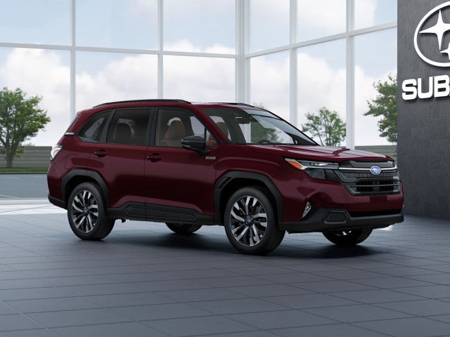 2026 Subaru FORESTER Touring Hybrid in Dark Mahogany Pearl — front three-quarter view