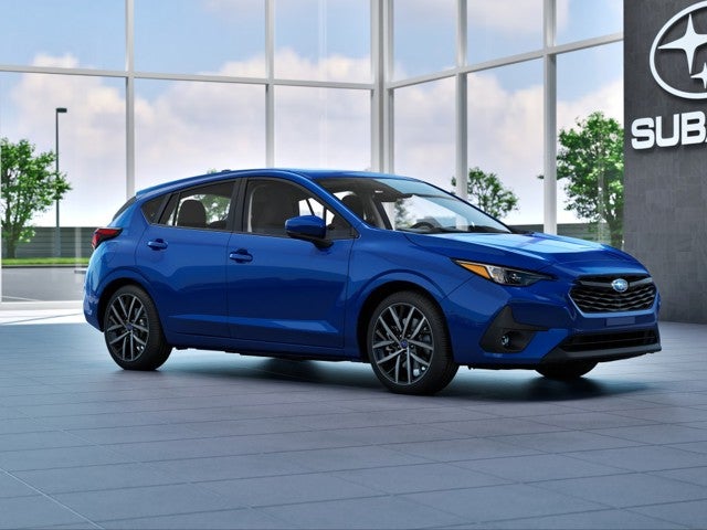2026 Subaru IMPREZA Sport in Sapphire Blue Pearl — front three-quarter view